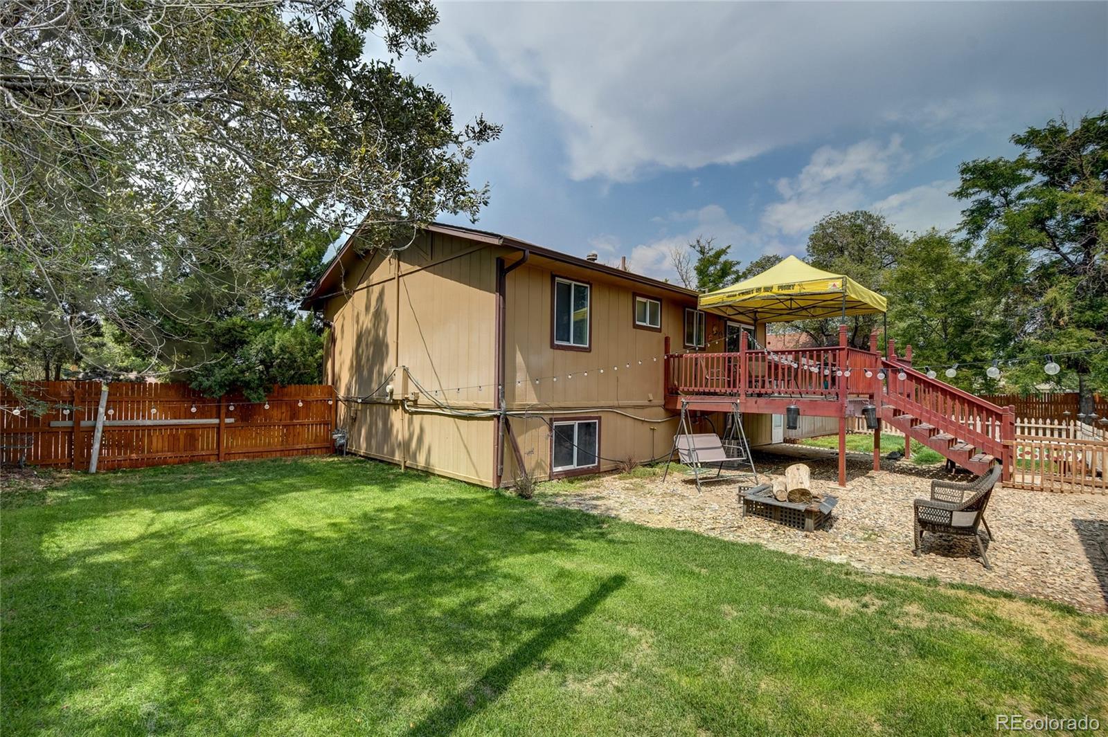 820 South Denver Avenue Fort Lupton, CO 80621 - Photo 23 of 40 a view of a house with backyard and sitting area