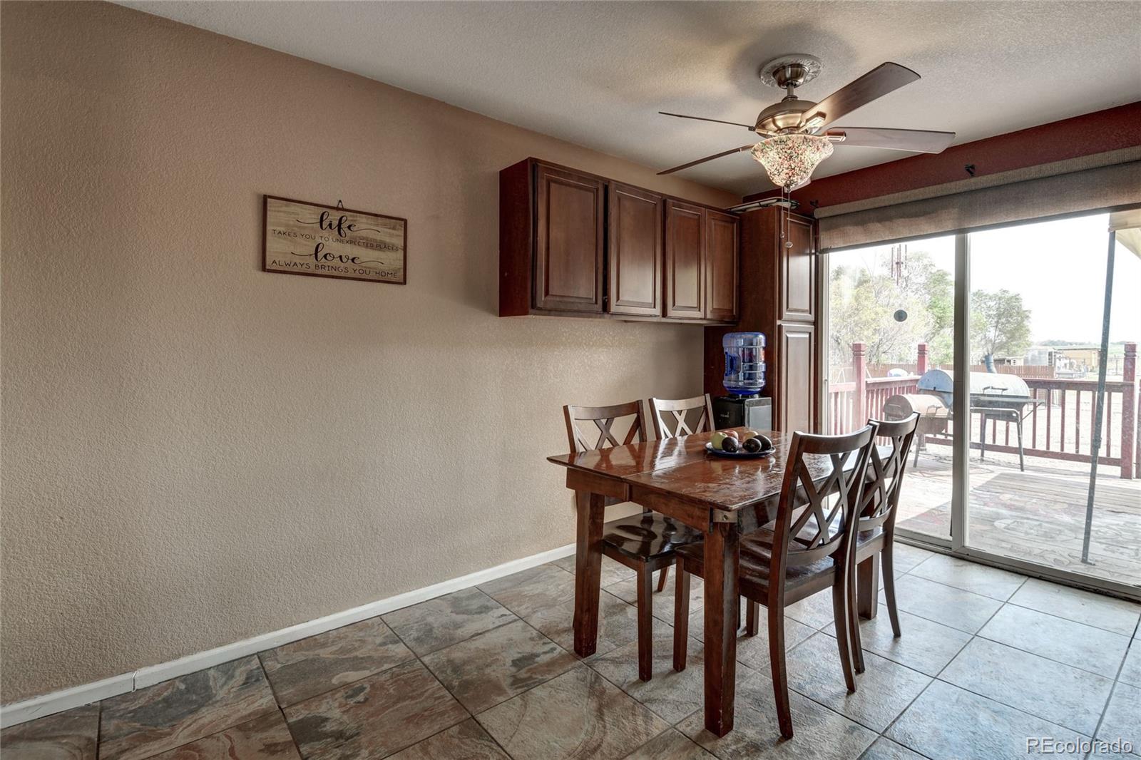 820 South Denver Avenue Fort Lupton, CO 80621 - Photo 3 of 40 a view of a dining room with furniture window and outside view