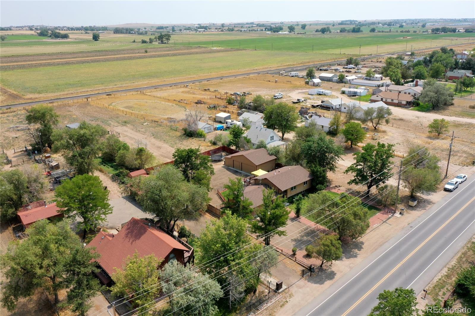 820 South Denver Avenue Fort Lupton, CO 80621 - Photo 37 of 40 an aerial view of ocean and residential houses with outdoor space