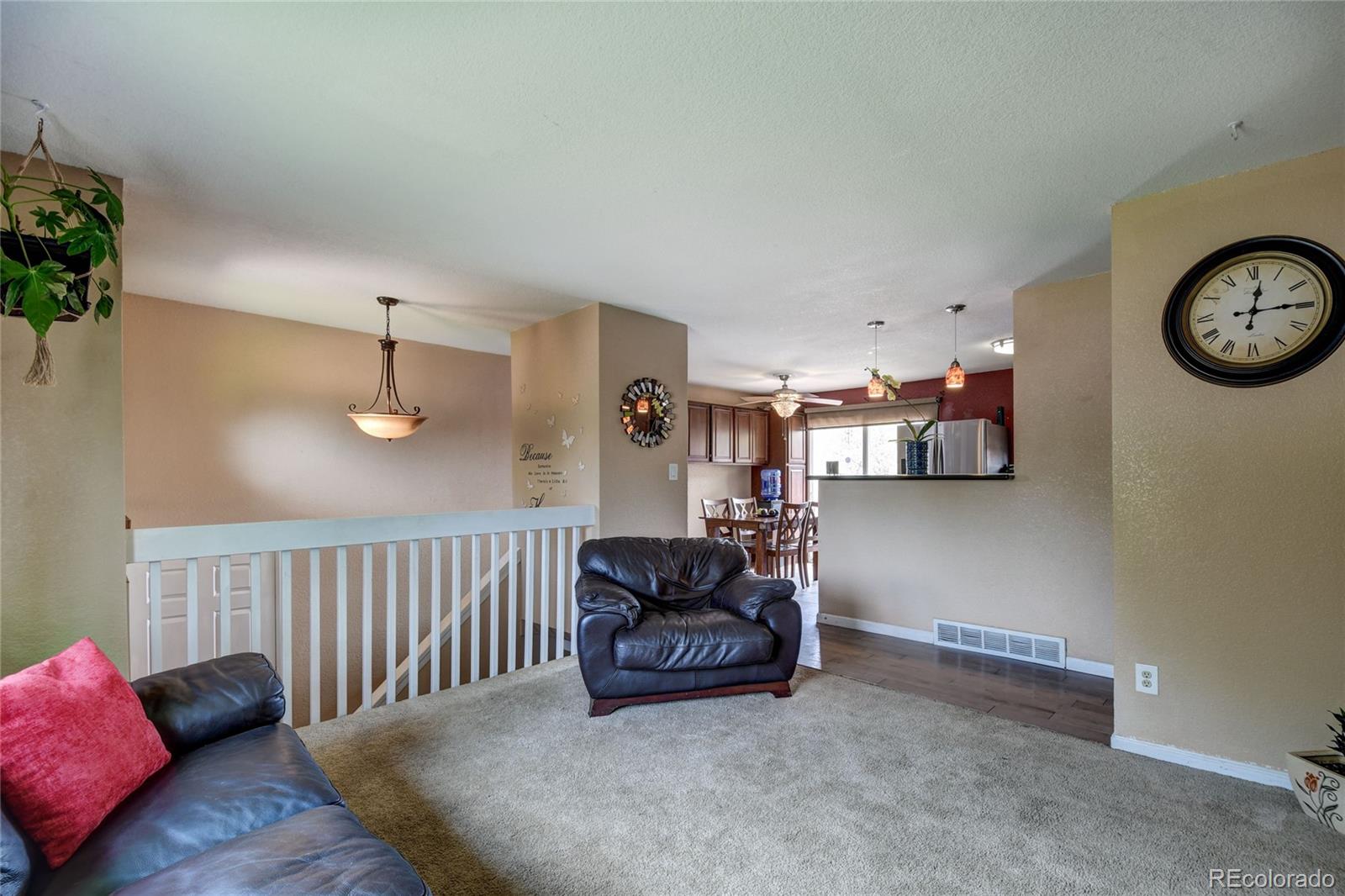 820 South Denver Avenue Fort Lupton, CO 80621 - Photo 5 of 40 a living room with furniture and a window