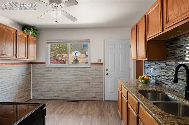 a kitchen with sink cabinets and window