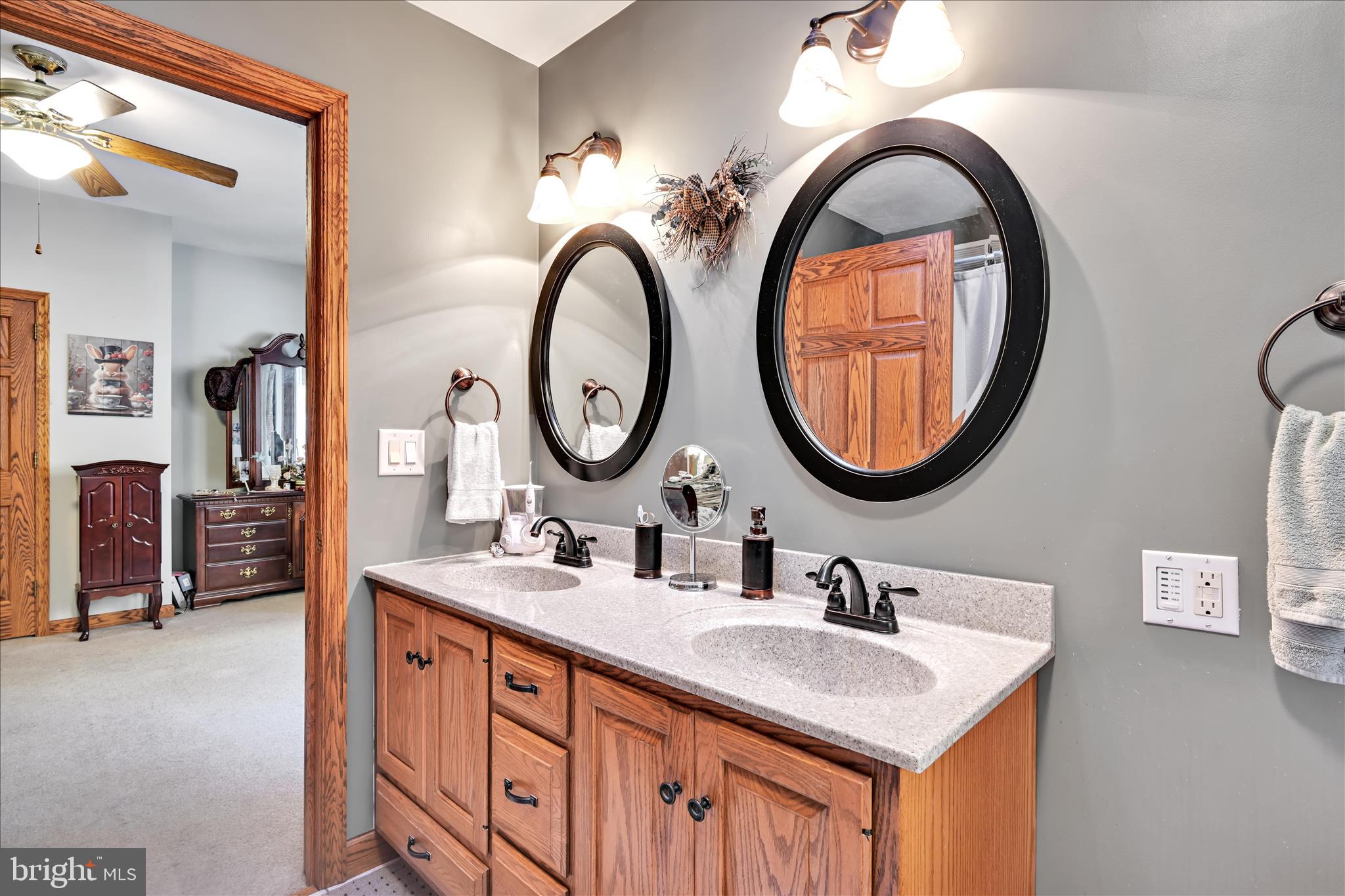 364 Michters Road Newmanstown, PA 17073 - Photo 26 of 56 a bathroom with a sink and a mirror