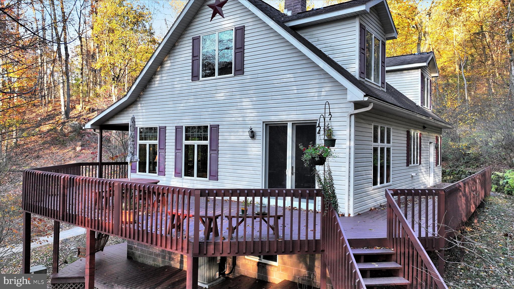364 Michters Road Newmanstown, PA 17073 - Photo 8 of 56 a view of a house with wooden deck and furniture