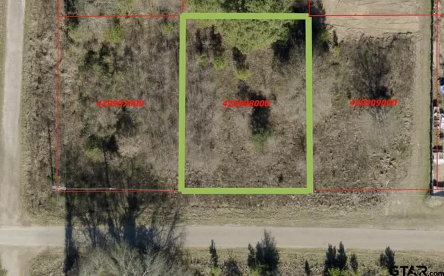 a view of a tree in front of a house