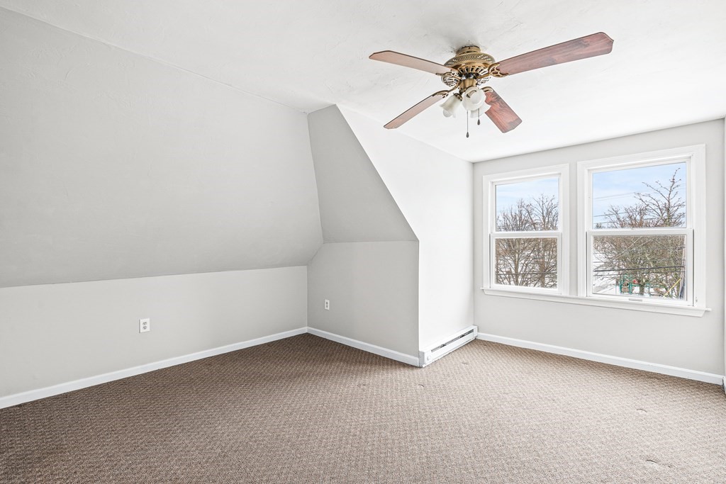 107-109 Mammoth Road Lowell, MA 01854 - Photo 24 of 32 an empty room with a window and a fan