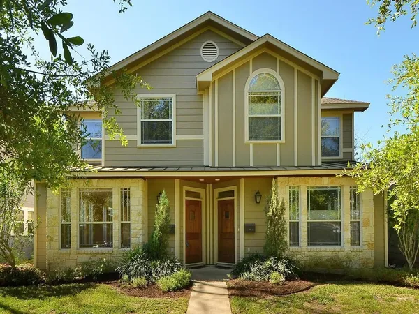 front view of a house with a yard