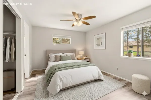 a bathroom with a sink a toilet a shower and a mirror