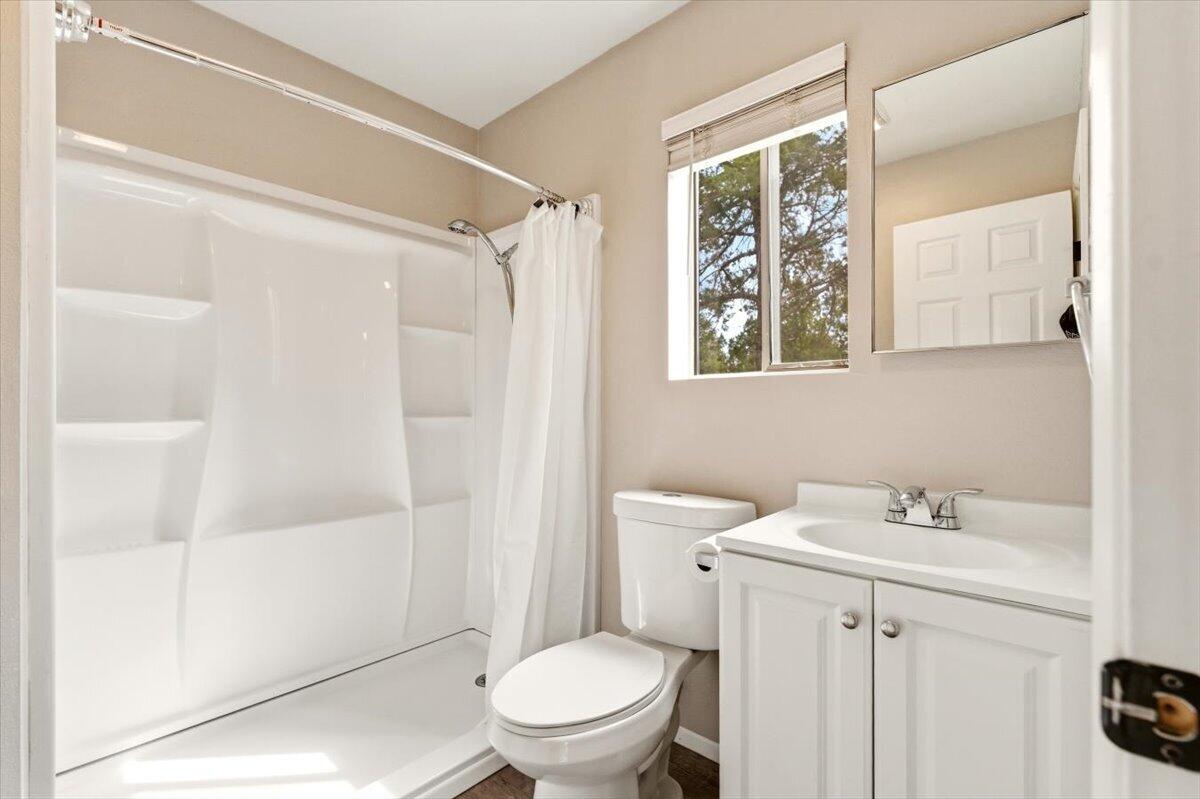 15617 Sherwood Road Weed, CA 96094 - Photo 19 of 58 a bathroom with a toilet a sink and a shower