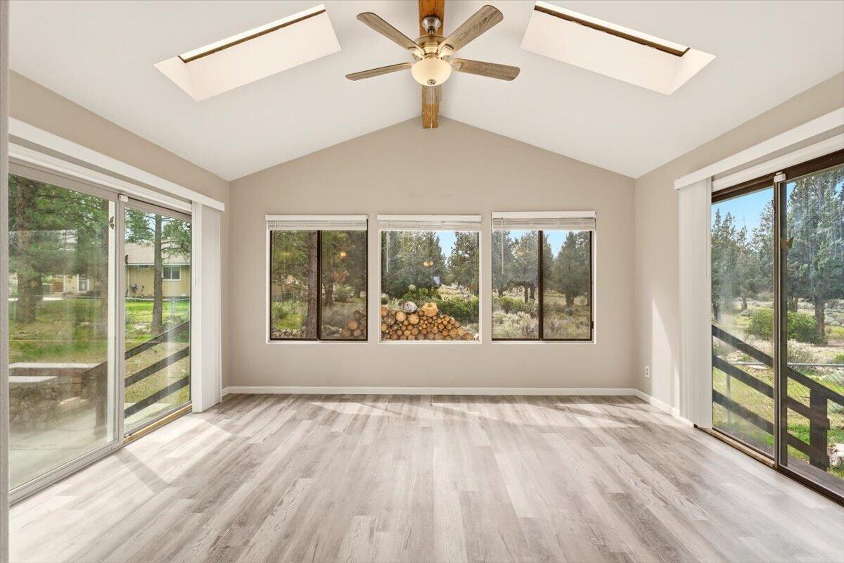 15617 Sherwood Road Weed, CA 96094 - Photo 20 of 58 a view of an empty room with a window and a ceiling fan