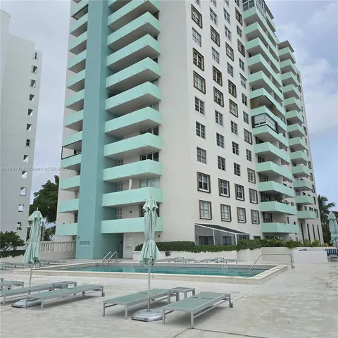 a gym hall with lots of gym equipment