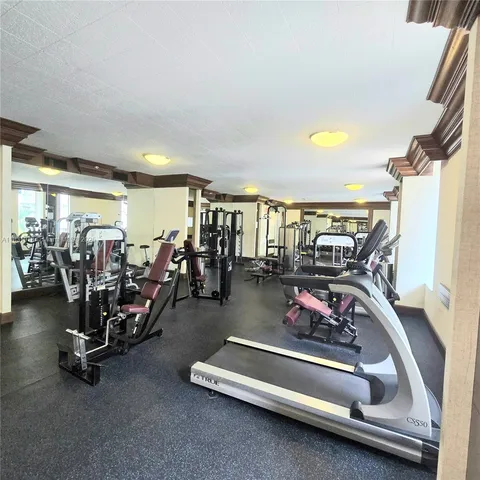 a view of walk in closet with empty room