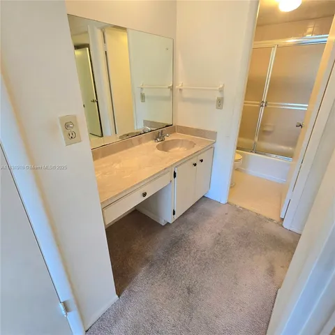 a bathroom with a shower and a toilet