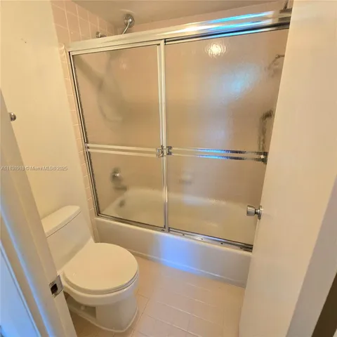 a view of bathroom with a shower and a sink