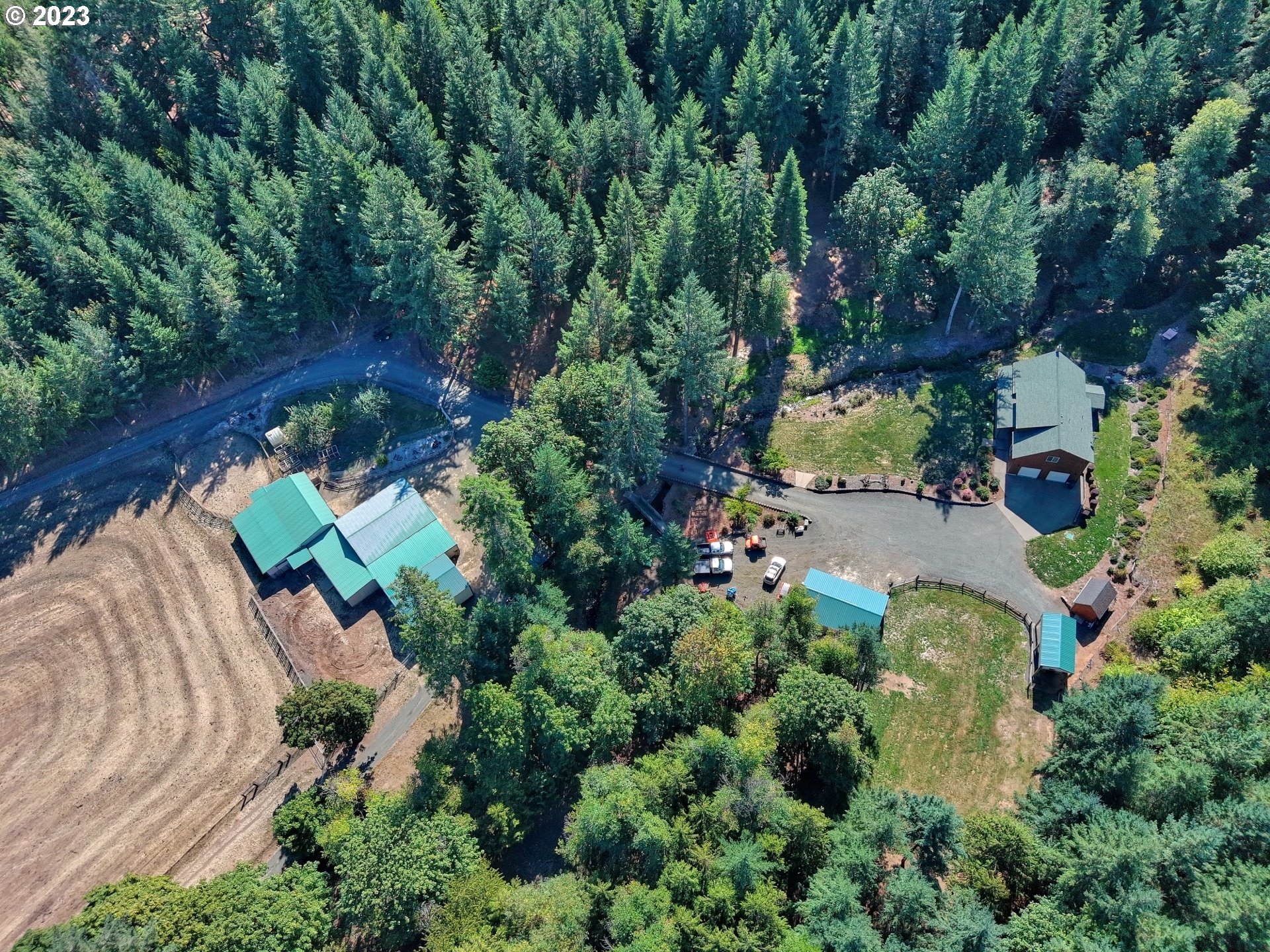 15360 May Road Dallas, OR 97338 - Photo 15 of 48 an aerial view of a house with a yard and outdoor seating