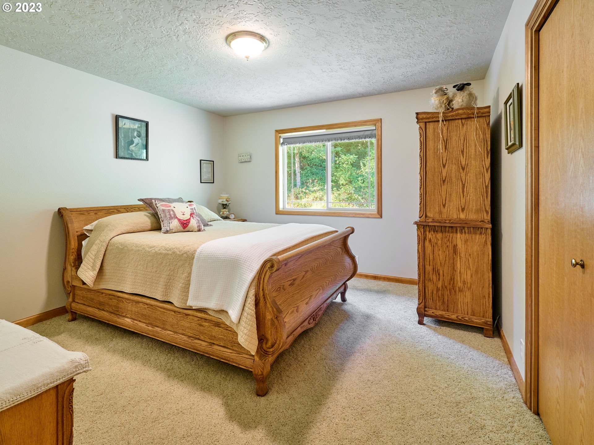 15360 May Road Dallas, OR 97338 - Photo 19 of 48 a bedroom with a bed and a window