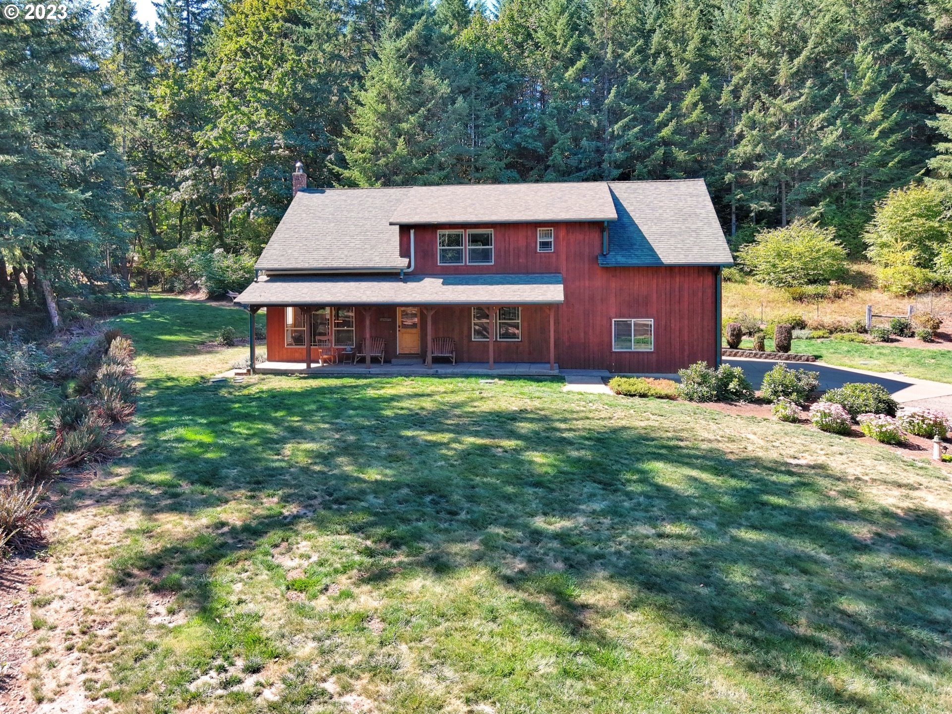 15360 May Road Dallas, OR 97338 - Photo 2 of 48 a view of a house with a big yard and large trees