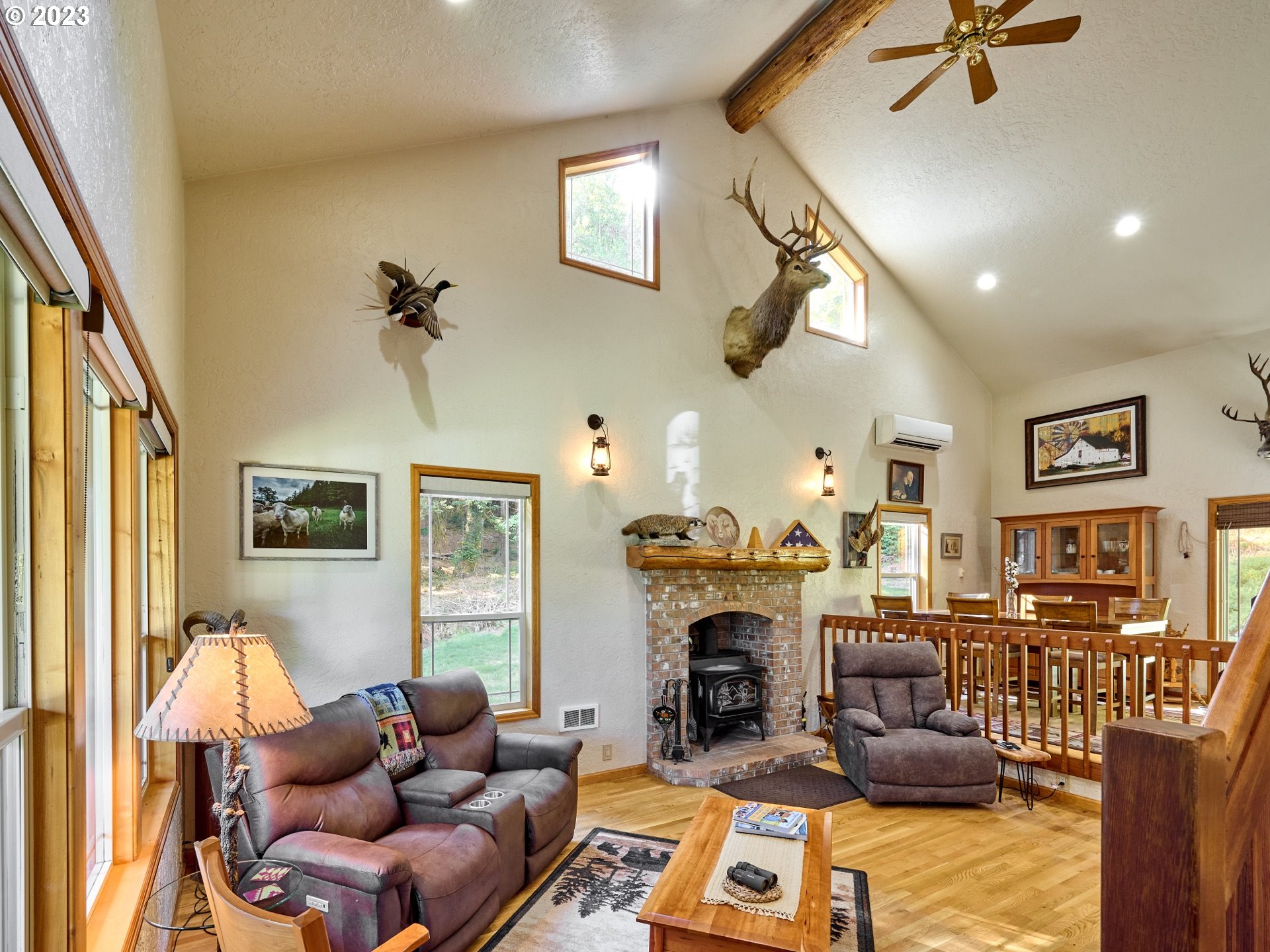 15360 May Road Dallas, OR 97338 - Photo 4 of 48 a living room with furniture a fireplace and a window