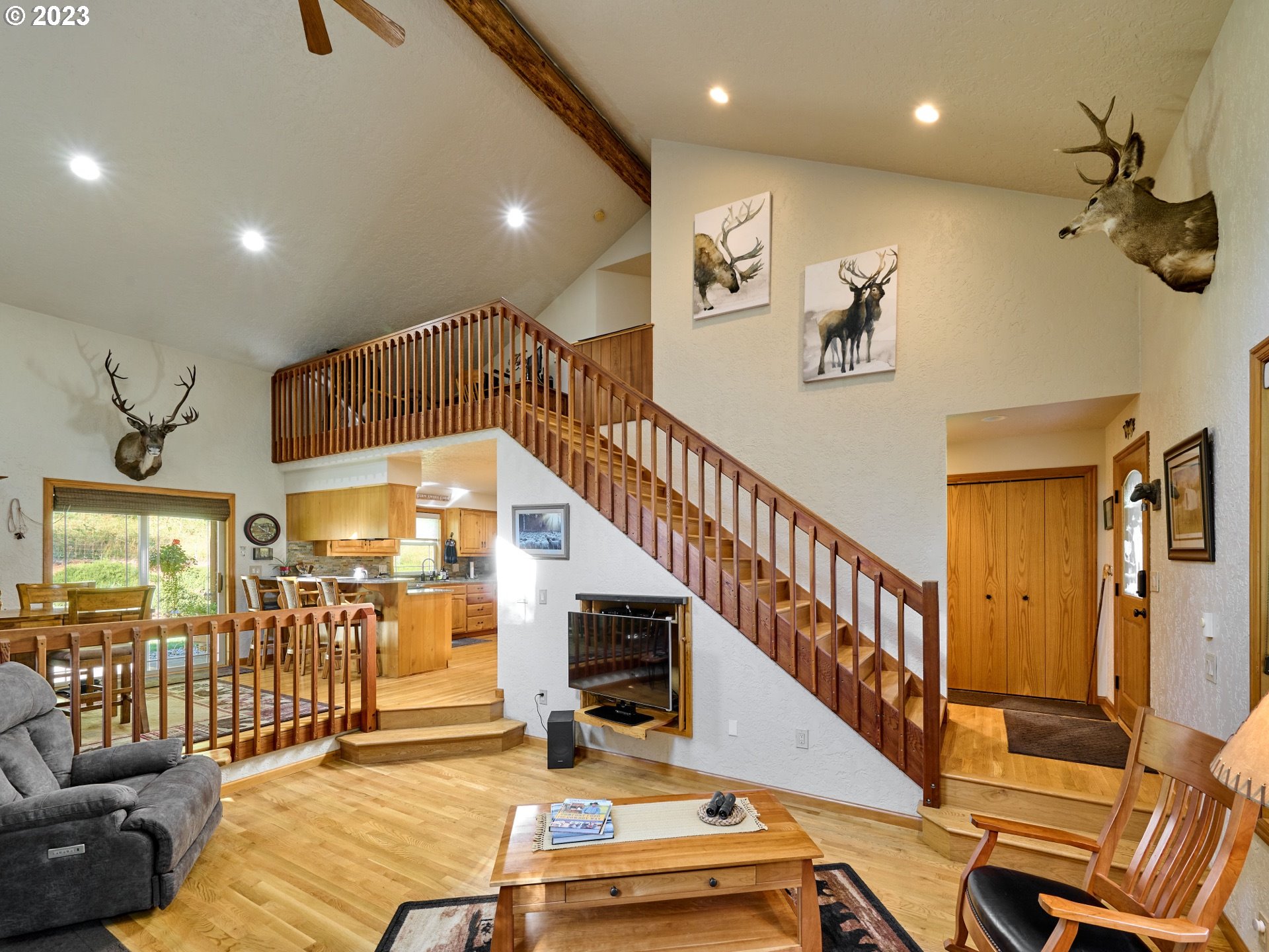 15360 May Road Dallas, OR 97338 - Photo 5 of 48 a view of a livingroom with furniture stairs and windows