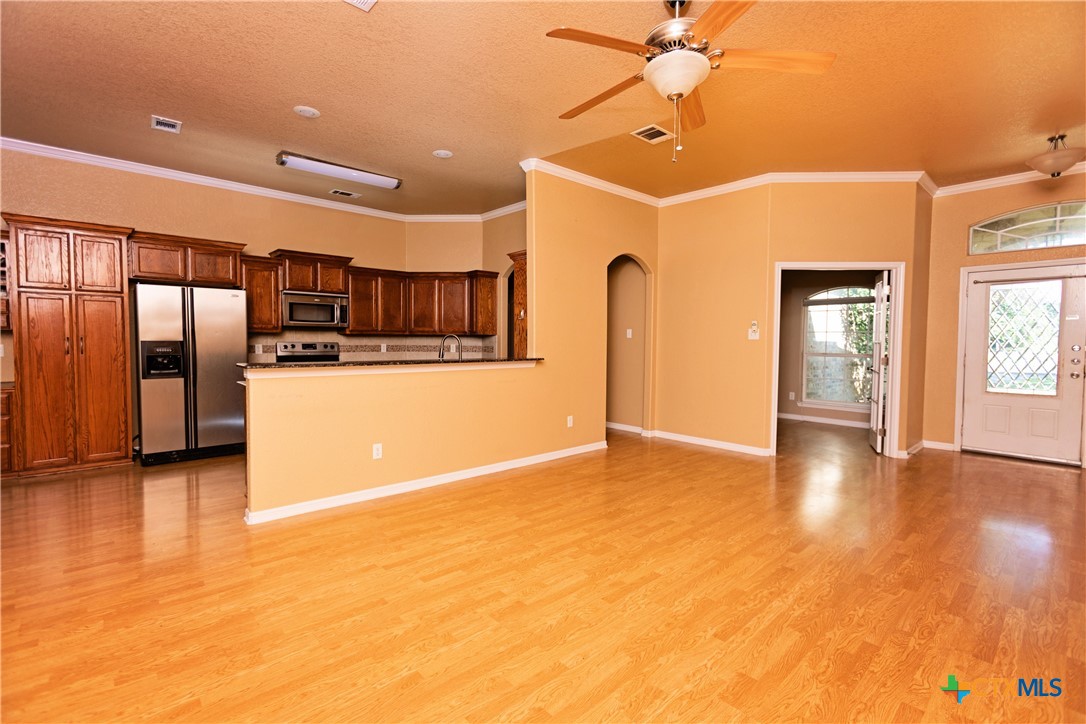 115 Squire Loop Belton, TX 76513 - Photo 11 of 38 a view of a kitchen with a dishwasher and a refrigerator