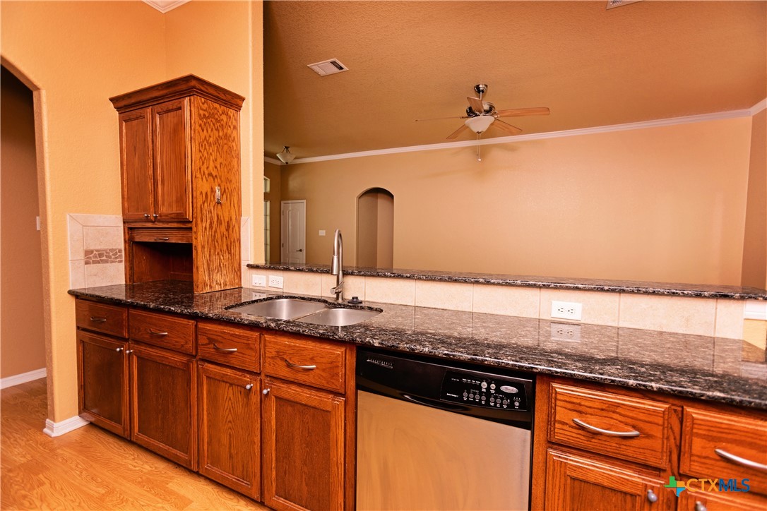 115 Squire Loop Belton, TX 76513 - Photo 17 of 38 a bathroom with a granite countertop sink and a mirror