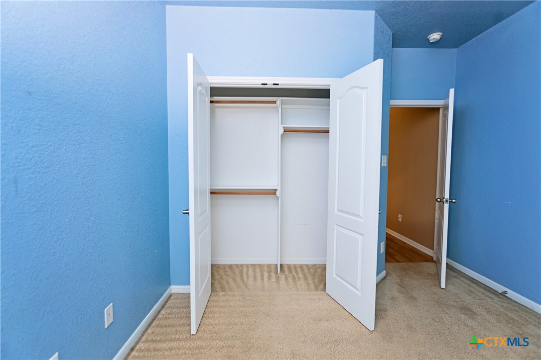 115 Squire Loop Belton, TX 76513 - Photo 21 of 38 an empty room with closet