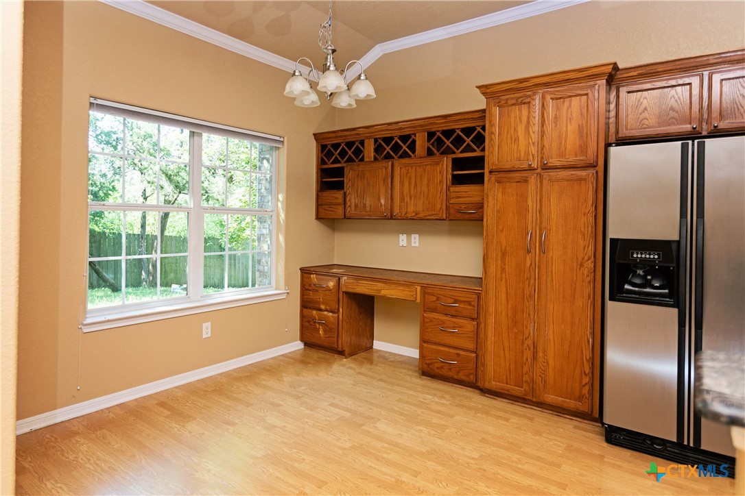 115 Squire Loop Belton, TX 76513 - Photo 27 of 38 a kitchen with stainless steel appliances granite countertop a refrigerator a sink and dishwasher with a large window