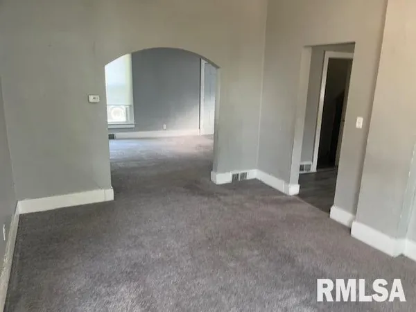 a kitchen with a sink and a refrigerator