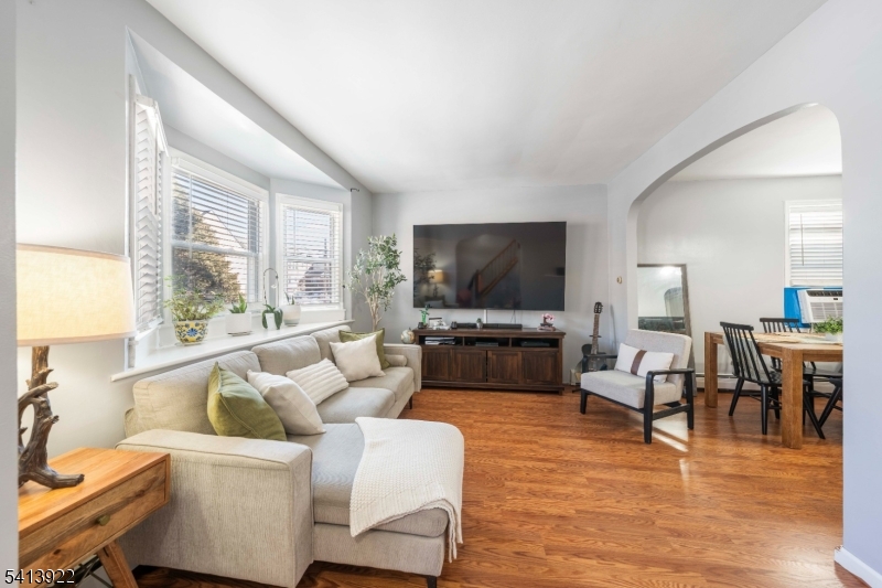 828 Allen Street Linden, NJ 07036 - Photo 5 of 18 a living room with furniture and a flat screen tv