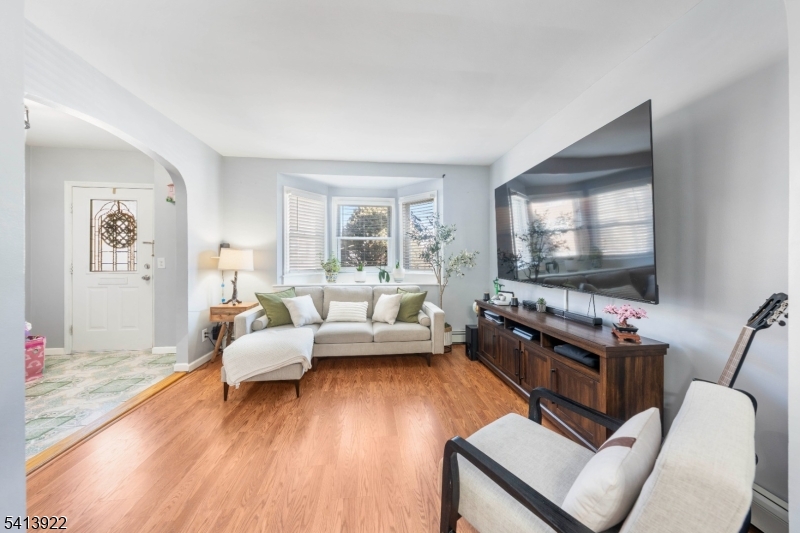 828 Allen Street Linden, NJ 07036 - Photo 6 of 18 a living room with furniture and a flat screen tv