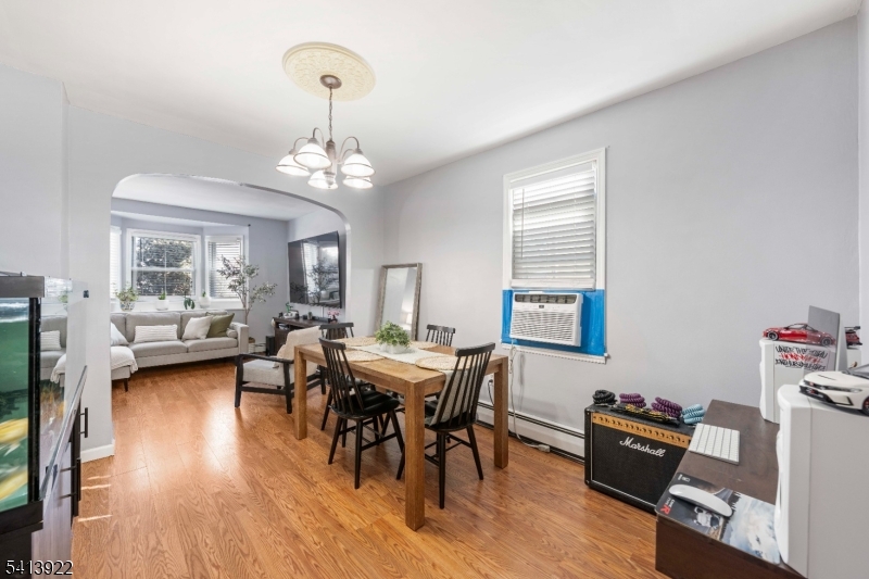 828 Allen Street Linden, NJ 07036 - Photo 7 of 18 a view of a dining room with furniture and wooden floor