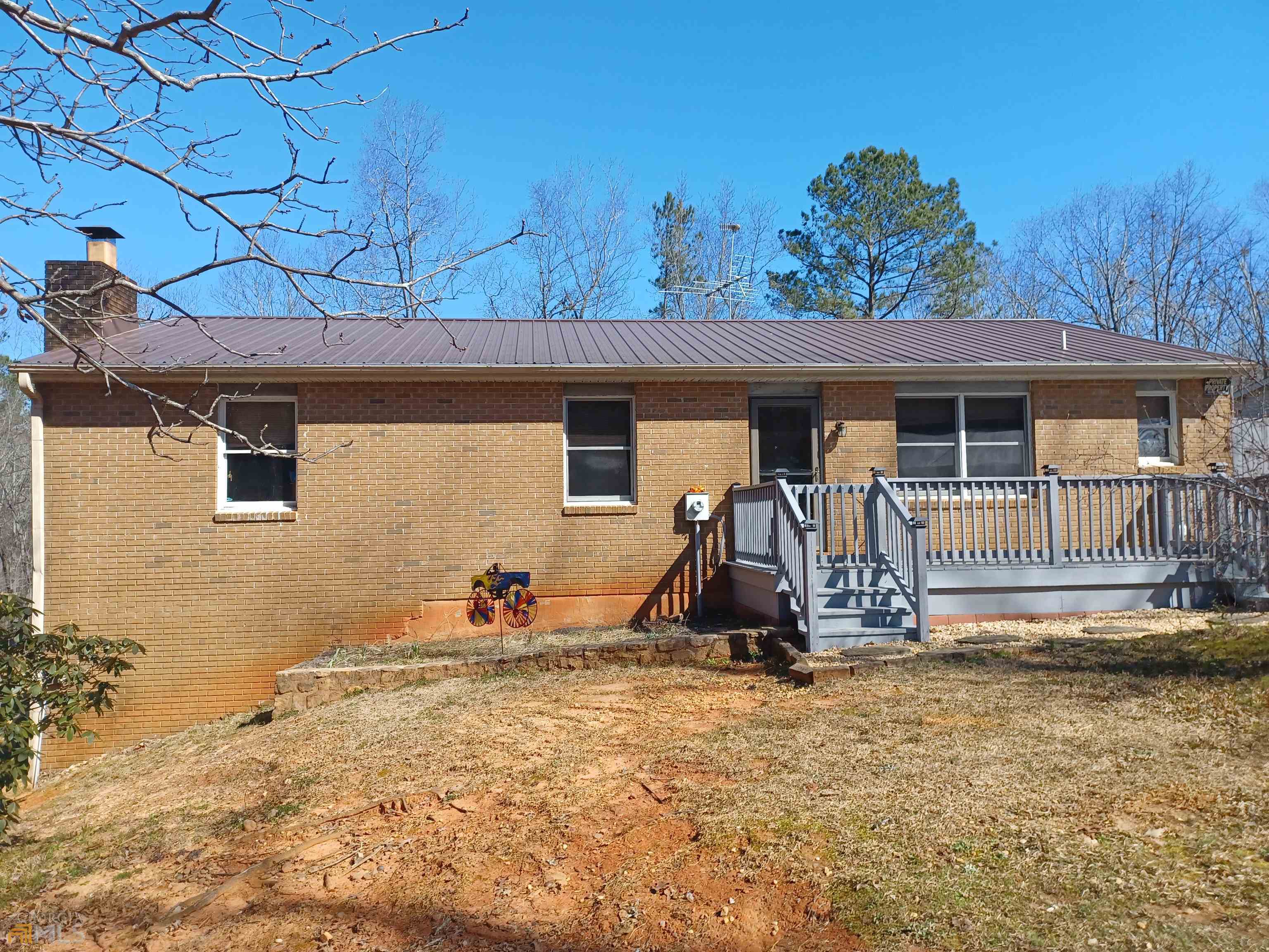 181 Flint Ridge Road Molena, GA 30258 - Photo 1 of 1 a view of a backyard with a table and chairs