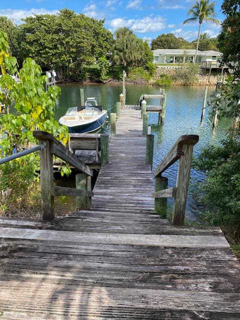 312 Southwind Drive, Unit 102 North Palm Beach, FL 33408 - Photo 15 of 18 a view of a lake with outdoor seating