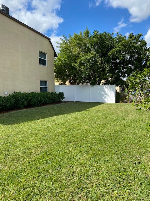 312 Southwind Drive, Unit 102 North Palm Beach, FL 33408 - Photo 17 of 18 a view of a back yard