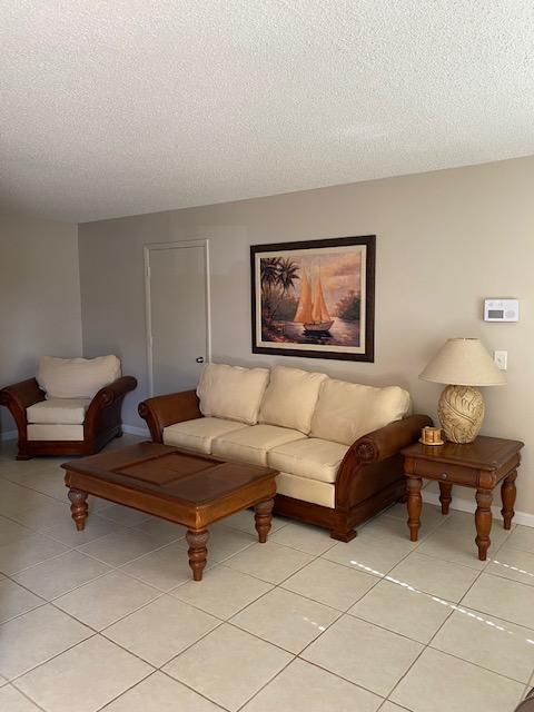 312 Southwind Drive, Unit 102 North Palm Beach, FL 33408 - Photo 2 of 18 a living room with furniture