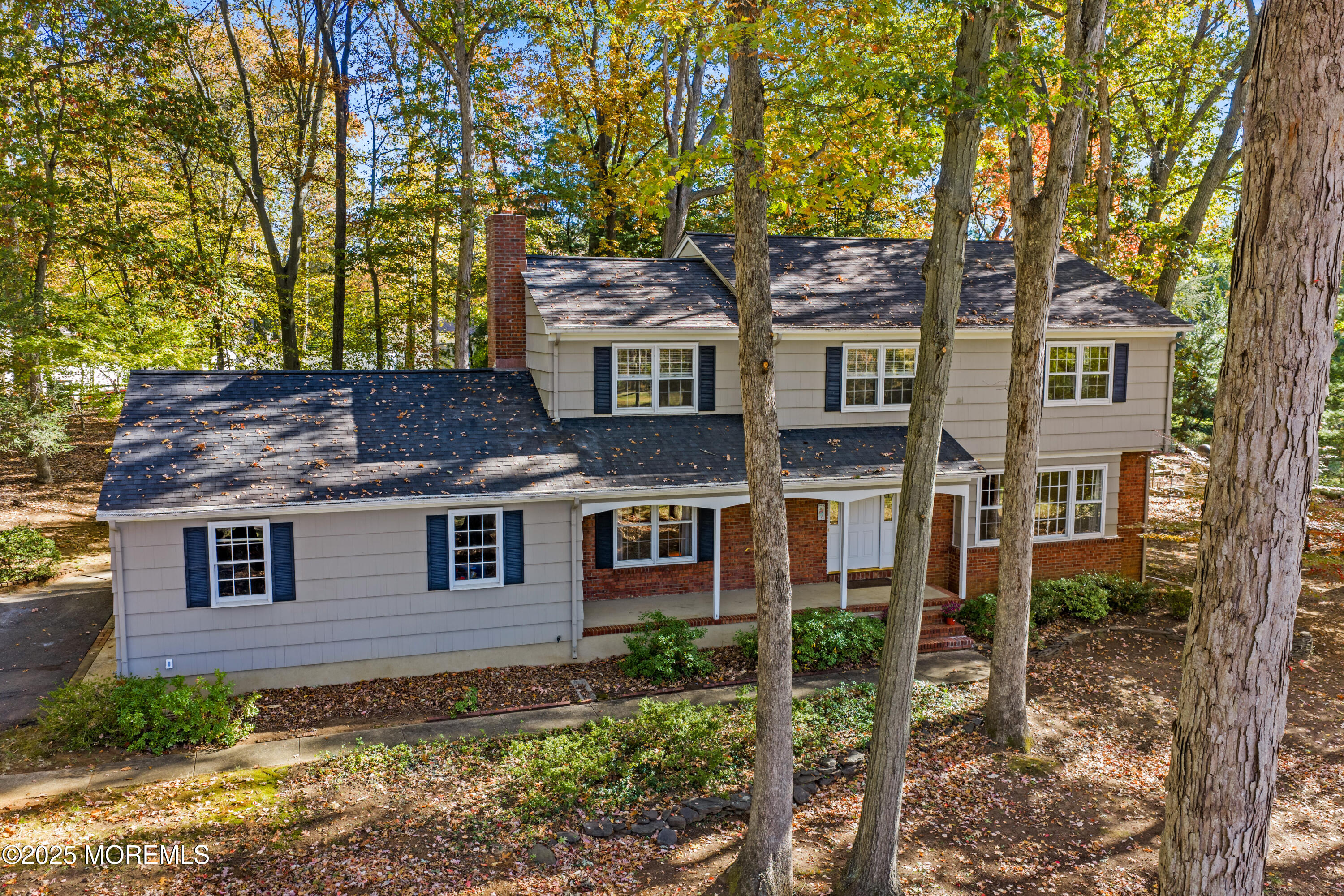 4 Brookside Drive Colts Neck, NJ 07722 - Photo 1 of 46 front view of a house with a tree