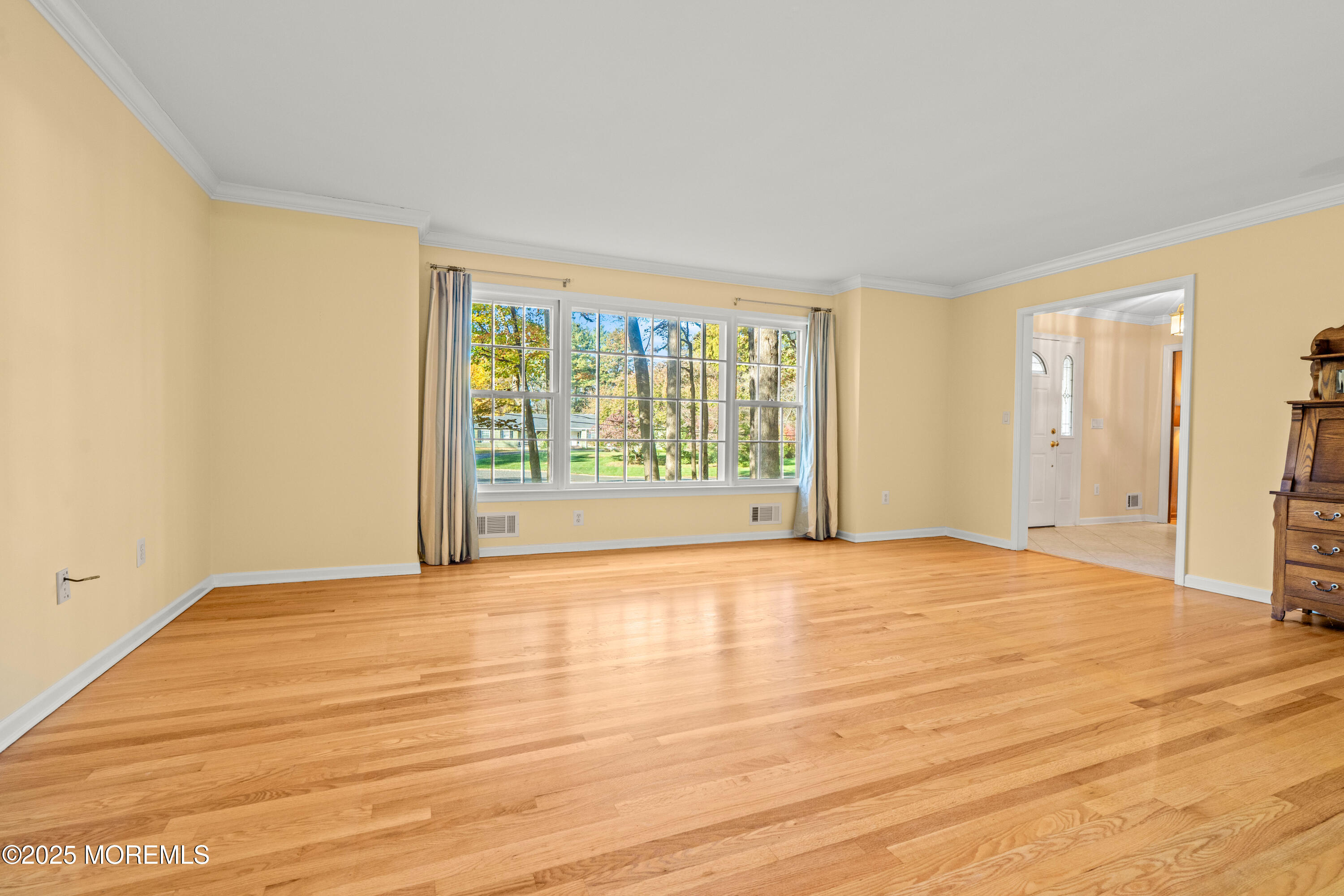 4 Brookside Drive Colts Neck, NJ 07722 - Photo 15 of 46 a view of an empty room with wooden floor and a window