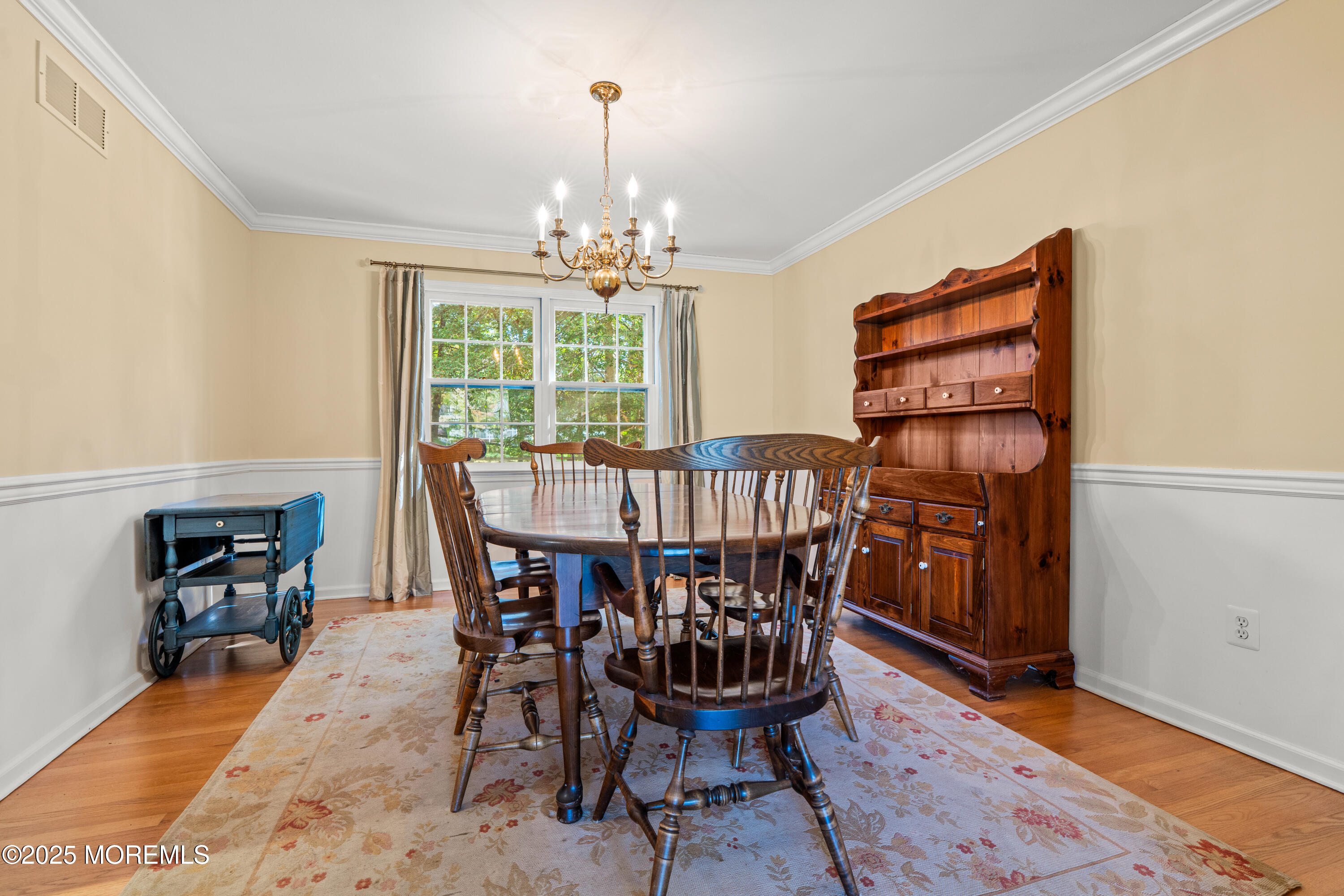 4 Brookside Drive Colts Neck, NJ 07722 - Photo 17 of 46 a view of a dining room with furniture and chandelier