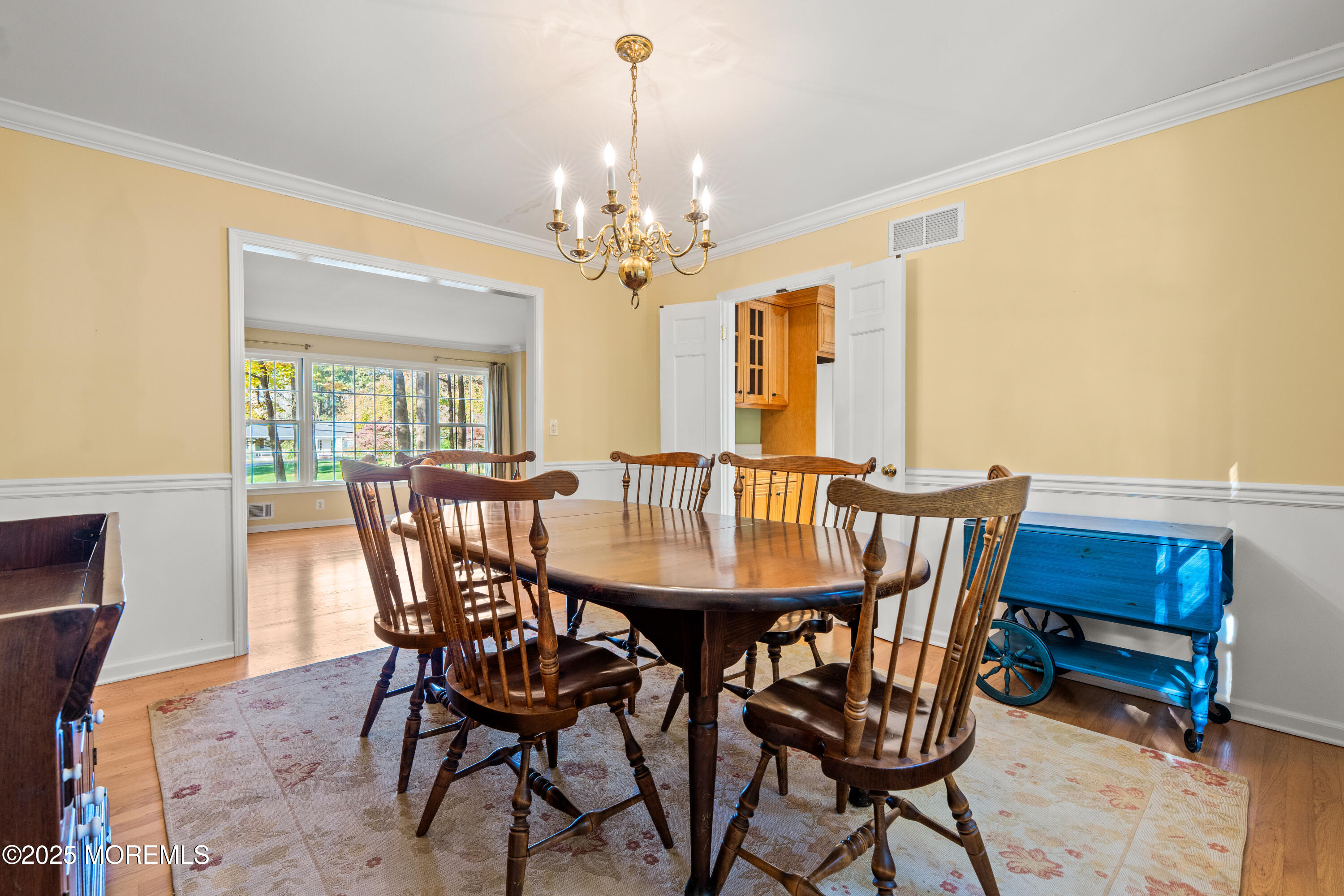 4 Brookside Drive Colts Neck, NJ 07722 - Photo 18 of 46 a view of a dining room with furniture and a chandelier