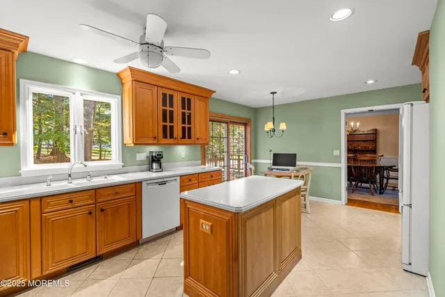 a kitchen with a stove sink and refrigerator
