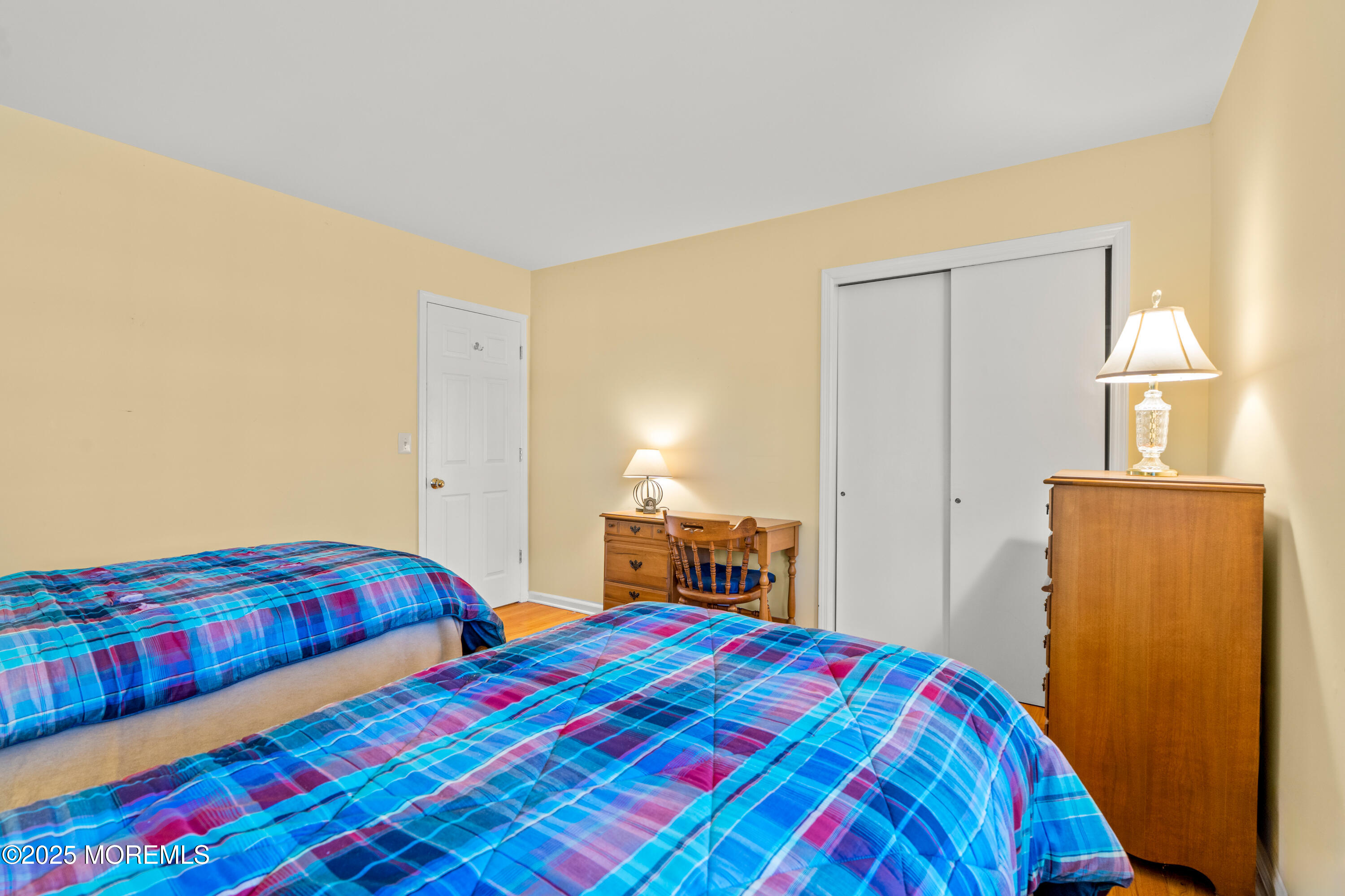 4 Brookside Drive Colts Neck, NJ 07722 - Photo 38 of 46 a bedroom with a bed and a closet