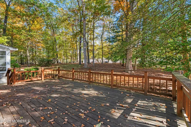 a view of a balcony with trees