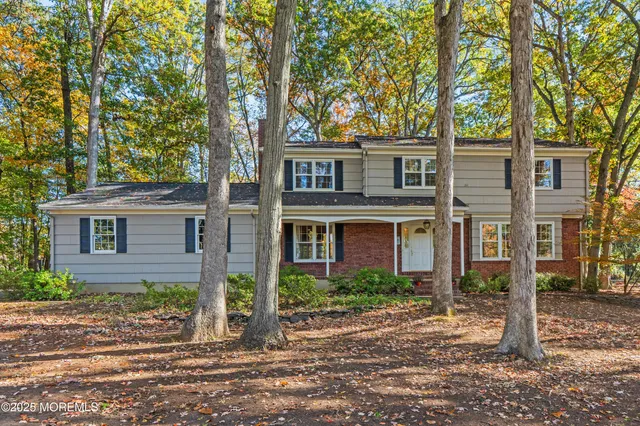 front view of a house with a tree
