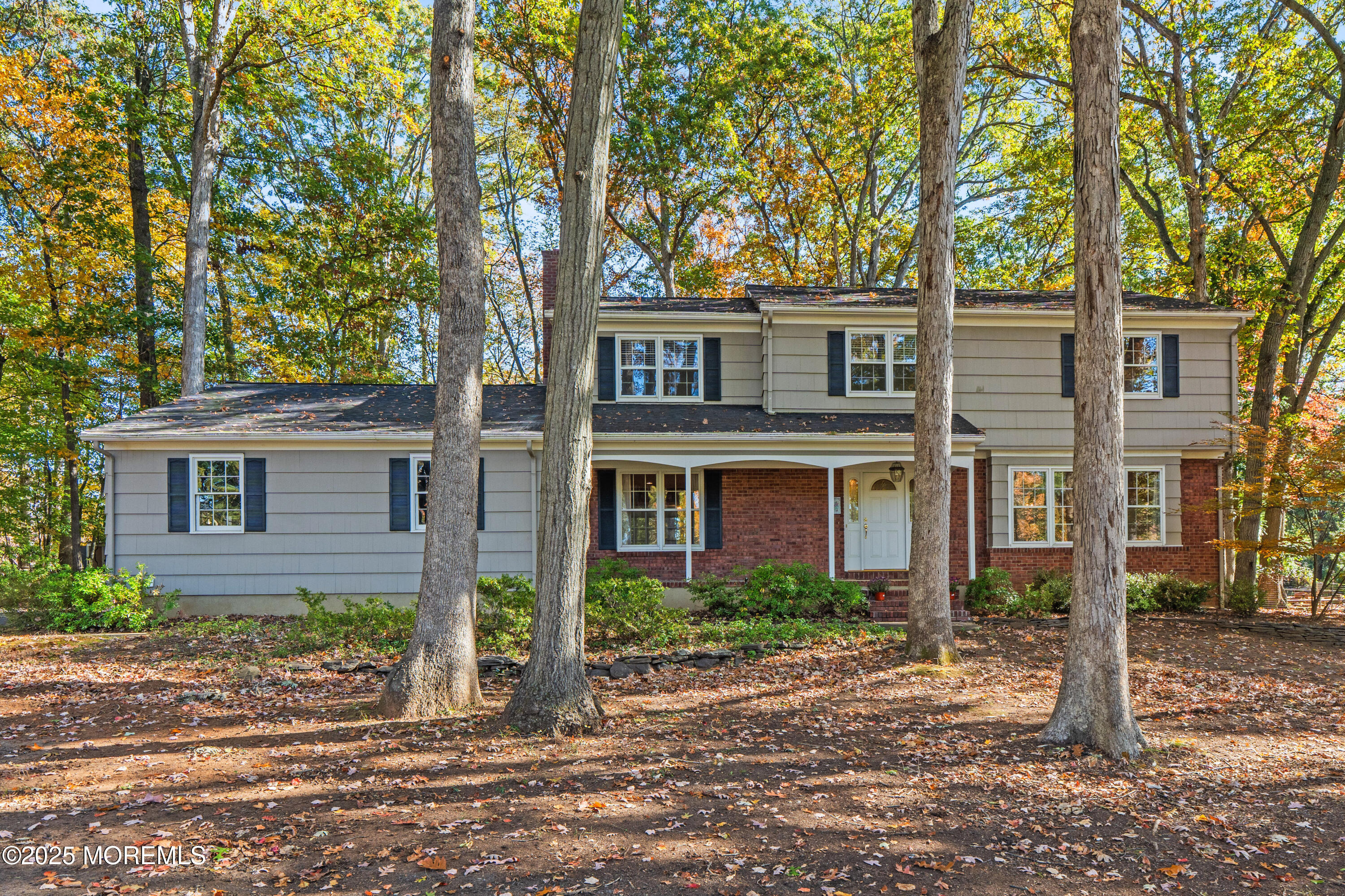 4 Brookside Drive Colts Neck, NJ 07722 - Photo 6 of 46 front view of a house with a tree