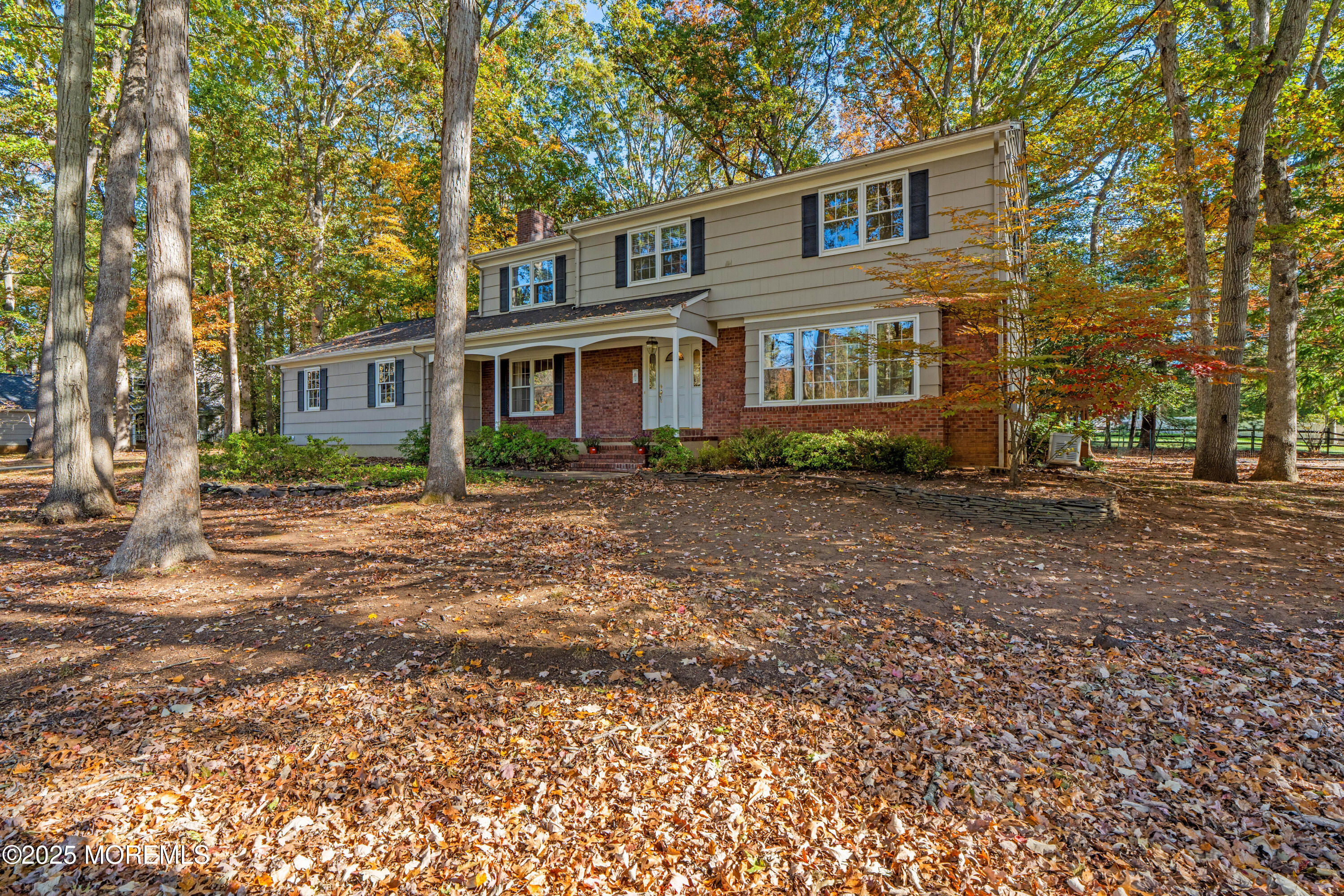 4 Brookside Drive Colts Neck, NJ 07722 - Photo 7 of 46 a front view of a house with garden