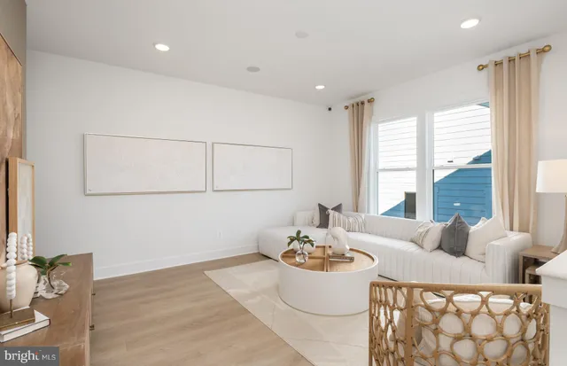 a spacious bedroom with a bed and a couch