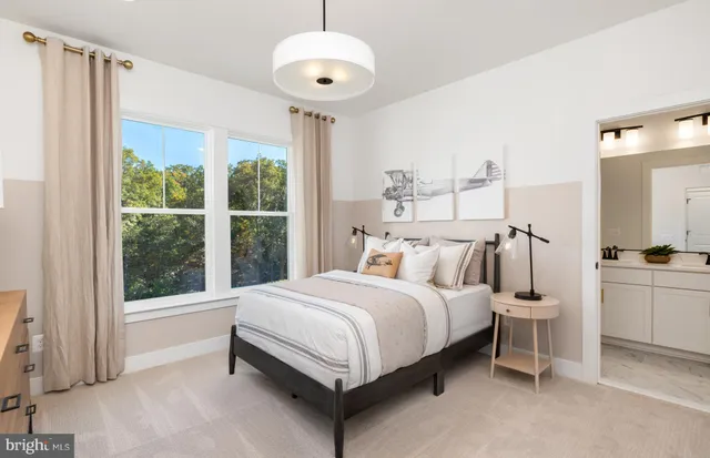 a bathroom with a sink a toilet a glass door a shower and a mirror