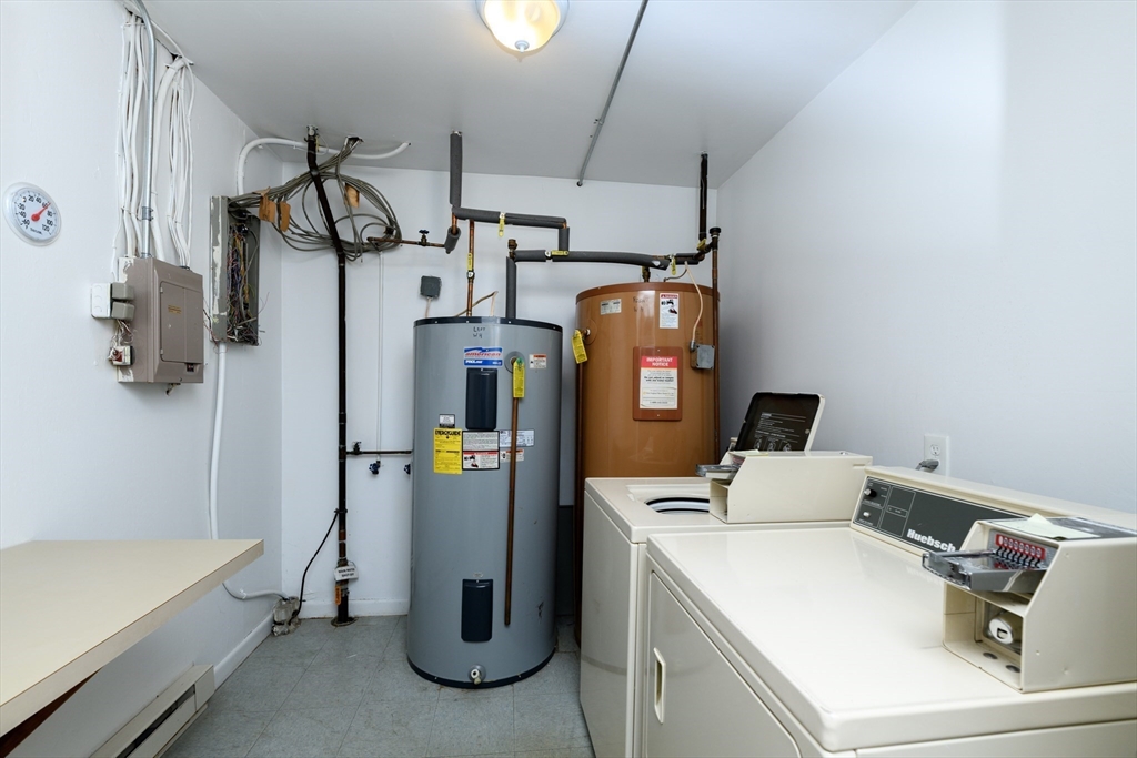 121 Bailey Street, Unit F54 Worcester, MA 01602 - Photo 13 of 15 a utility room with dryer and washer