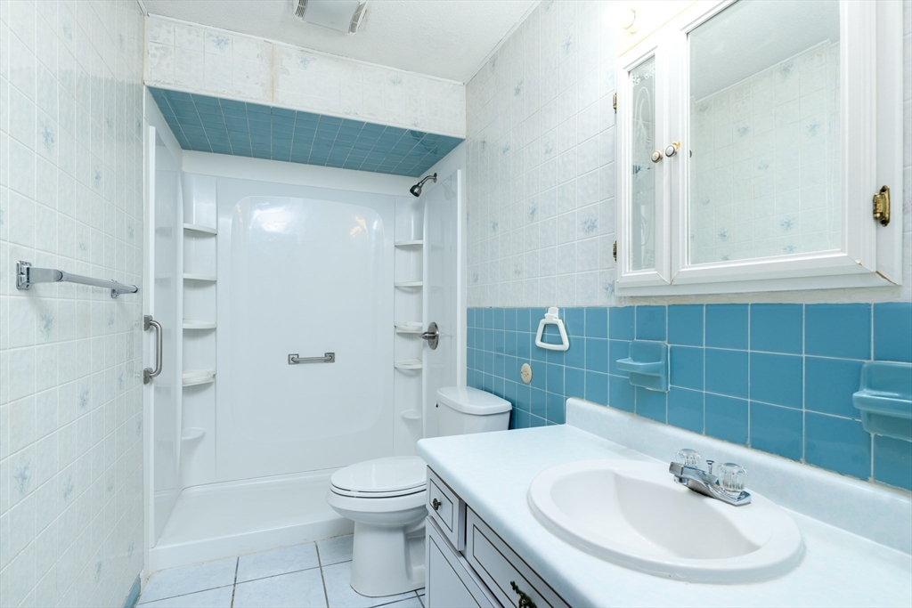 121 Bailey Street, Unit F54 Worcester, MA 01602 - Photo 14 of 15 a bathroom with a sink toilet and shower