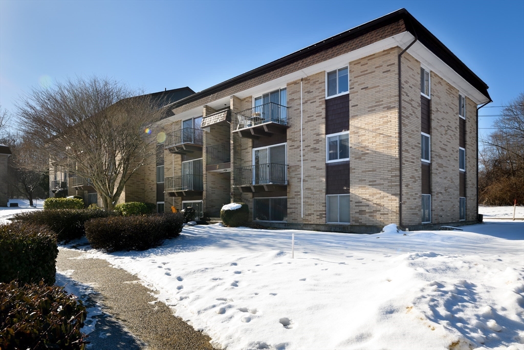 121 Bailey Street, Unit F54 Worcester, MA 01602 - Photo 3 of 15 a view of a house with a yard