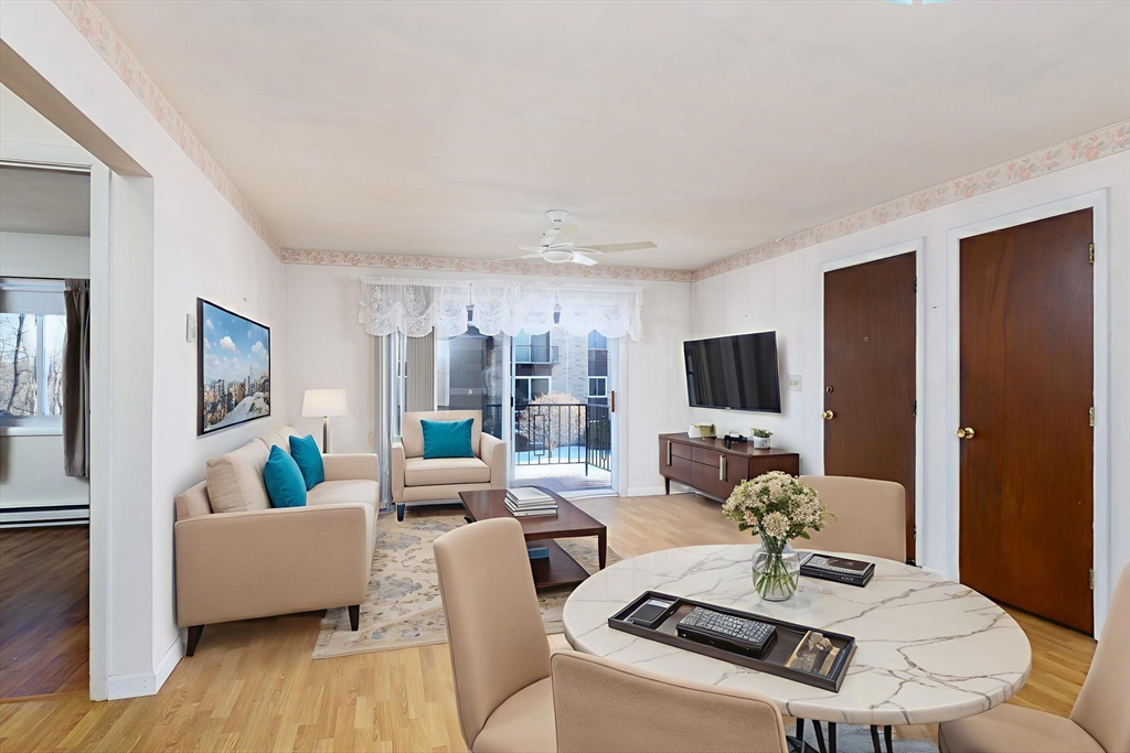 121 Bailey Street, Unit F54 Worcester, MA 01602 - Photo 8 of 15 a living room with furniture and a flat screen tv